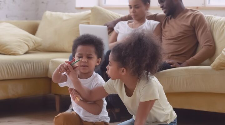 children playing parents on sofa